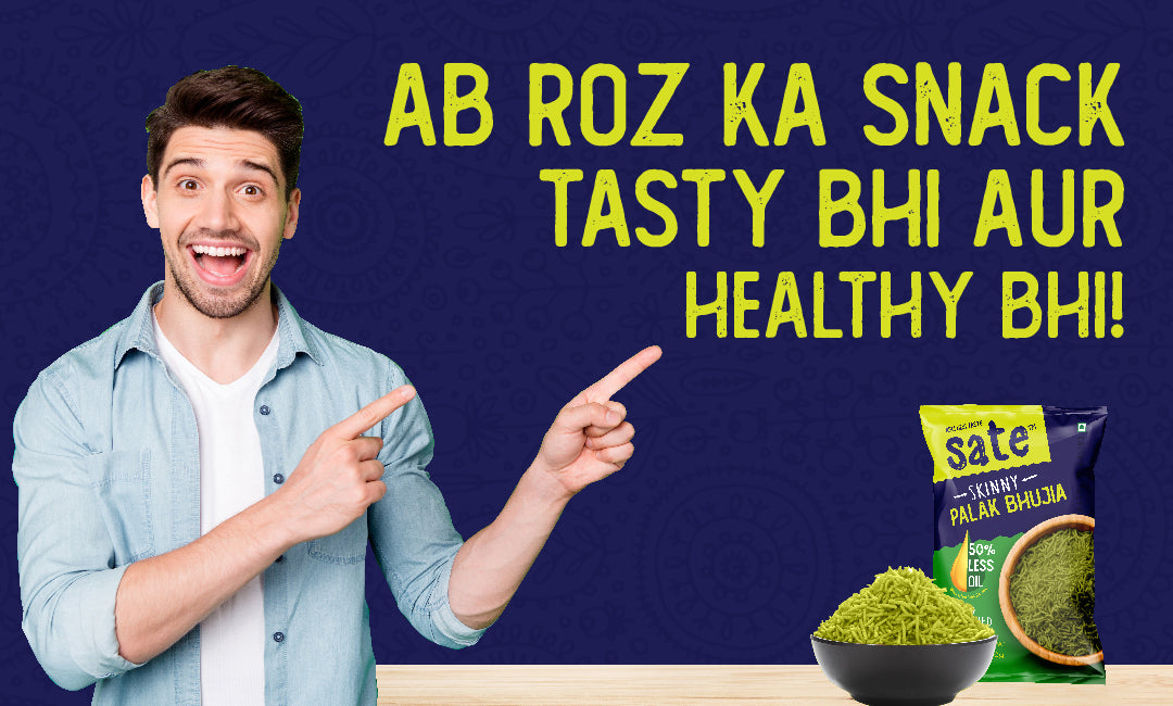 Man pointing towards a healthy snack pack and bowl of baked Palak Bhujia with the text 'Ab Roz Ka Snack Tasty Bhi Aur Healthy Bhi!' on a dark blue background.