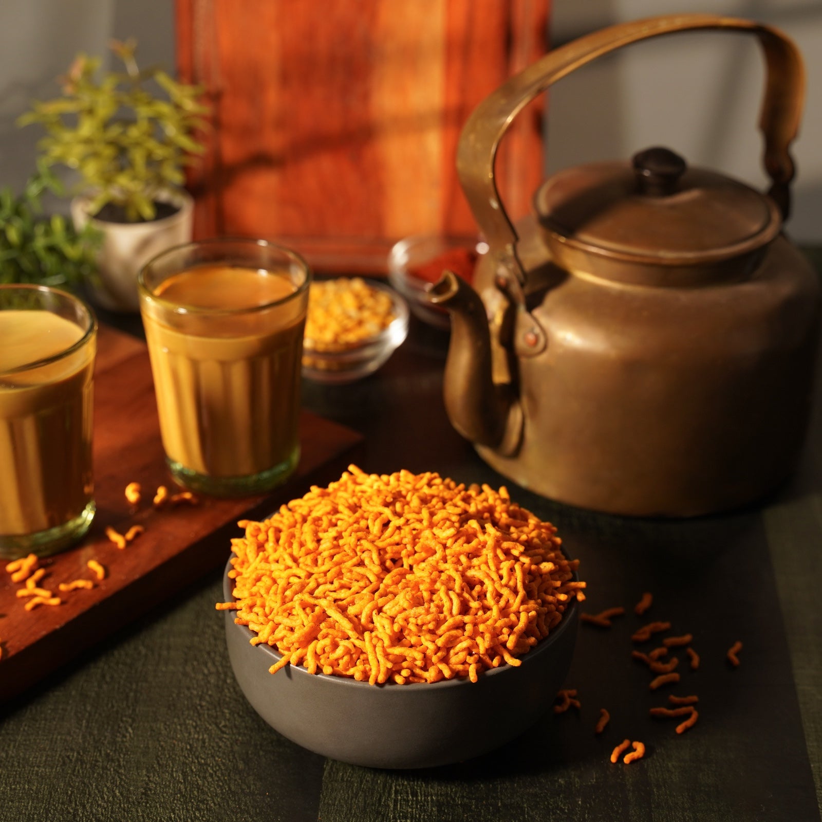 A bowl of peri peri Protein Sev with chai great evening snacks.